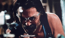 a man wearing glasses says thunderation in a video