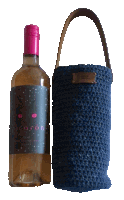 a bottle of picaron wine next to a blue knitted carrying bag