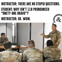 a group of soldiers are sitting around a table with a man giving a presentation