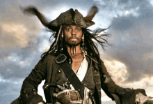 a man dressed as a pirate with dreadlocks