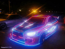 a picture of a car with neon lights on it is taken from girlincat.com