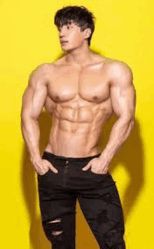 a shirtless muscular man is standing in front of a yellow background .