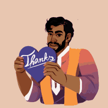 a man holding a heart that says thanks