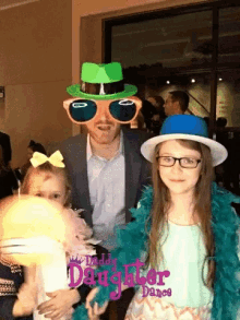 a man and two little girls pose for a photo with daddy daughter dance written on the bottom of the photo