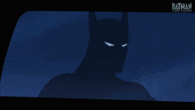 a silhouette of batman is on a screen that says batman comic con