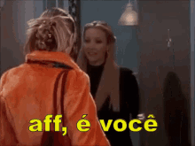 two women are standing next to each other and the words aff e voce are written in yellow