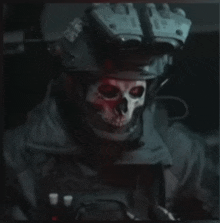 a man with a skull painted on his face wears a helmet