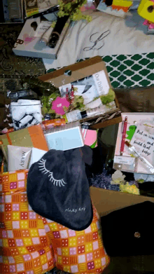 a mary kay bag sits on top of a pile of items