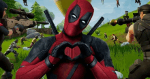 deadpool making a heart shape with his hands