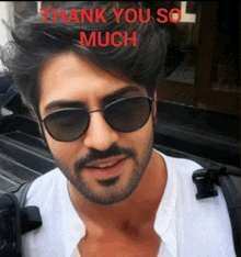 a man wearing sunglasses says thank you so much in red letters