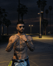 a shirtless man with a tattoo on his chest is standing on a sidewalk with palm trees in the background