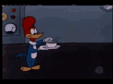 woody woodpecker is holding a cup of coffee with a spoon on a plate .