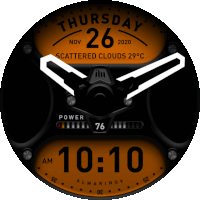 a black and orange clock displays the time as 10:10