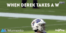 a football player wearing a buffalo bills helmet on a field with the words " when derek takes a w "