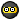 a black circle with a yellow border and a smiley face in the middle .