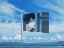 a flag with a picture of a boy on it flying in the wind