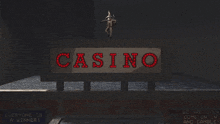 a sign that says casino on it in red