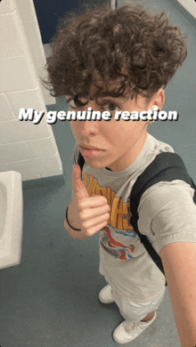 a person with curly hair giving a thumbs up with the words my genuine reaction behind them