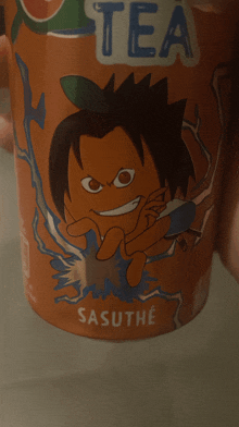 a person is holding a cup of sasuto tea