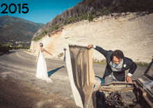 a bride and groom are standing next to a car with the year 2015 on the bottom