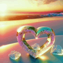 a heart made of ice sits on a beach with a sunset in the background