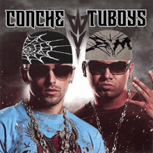 a man wearing sunglasses and a bandana is standing next to another man wearing sunglasses and a bandana