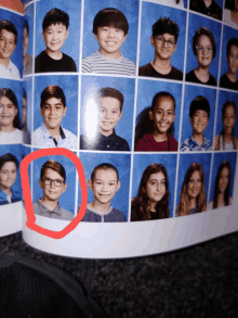 a picture of a boy with glasses is in a yearbook