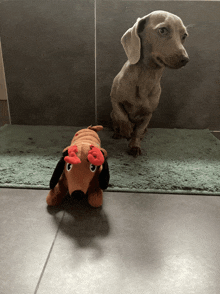 a stuffed dachshund with antlers on its head