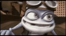 a frog wearing goggles and a helmet looks at the camera