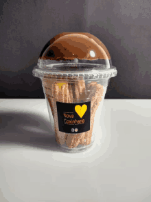 a cup of churros with a label that says nova coxinharia on it