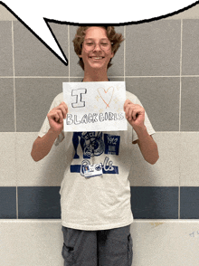 a young man holding a sign that says i love black girls