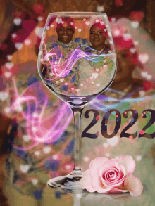 a picture of a couple in a wine glass with 2022 written on it