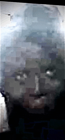 a pixelated image of a person 's face with a gray background