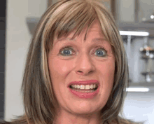 a close up of a woman making a funny face with her mouth open