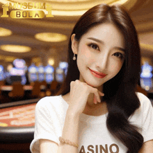 a woman is wearing a white shirt that says casino