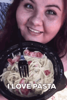 a woman is holding a bowl of pasta with a fork and the words " i love pasta " above her