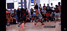 a basketball game is being played on a court sponsored by ballislife