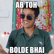 a man wearing sunglasses and a green shirt is making a funny face and says ab toh bolde bhai .