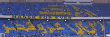 a stadium full of people with a banner that says nassr forever