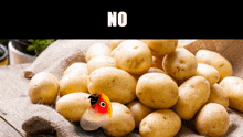 a pile of potatoes with the word no on the bottom right