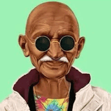 mahatma gandhi is wearing sunglasses and a jacket and smiling .