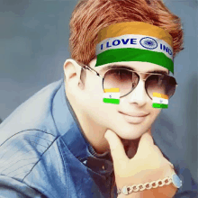 a young man wearing sunglasses and a headband that says " i love india "