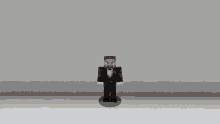 a minecraft character in a tuxedo is standing on a white surface