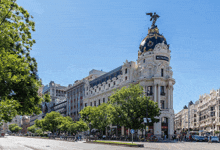 a building with a dome on top that says metropol