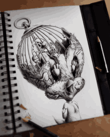 a black and white drawing of a bird in a cage on a spiral notebook