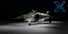 a green and brown fighter jet with a blue x on the bottom