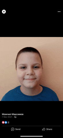 a young boy in a blue shirt is smiling in a facebook picture