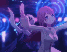 a girl with pink hair is dancing with another girl