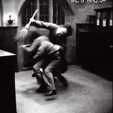 a black and white photo of a man holding a broom in a room with the time of 14:40