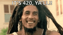 a man with dreadlocks and a beard is smiling and saying `` it 's 420 , y'all ! ''